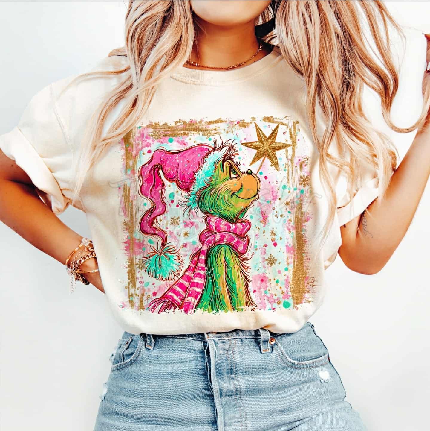 Green guy with pink hat and scarf looking at star