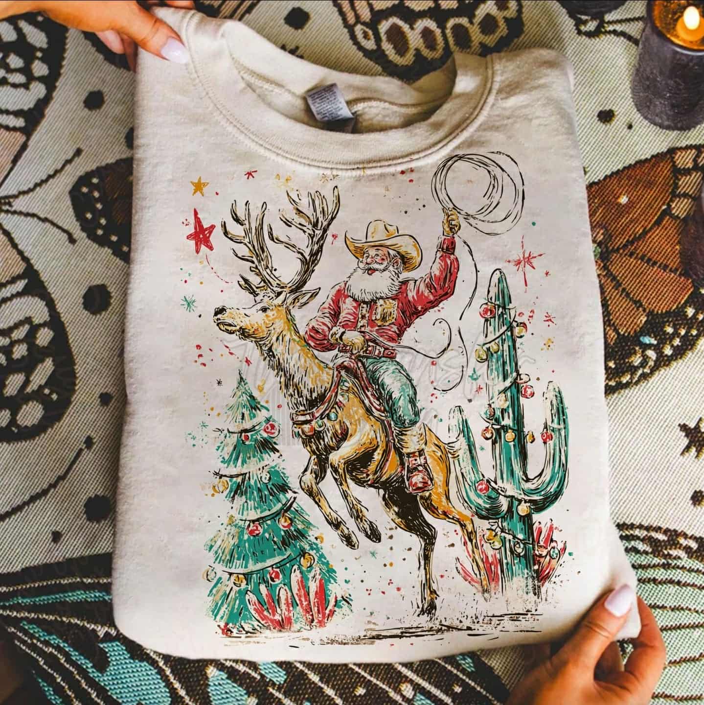 Western cowboy Santa riding reindeer